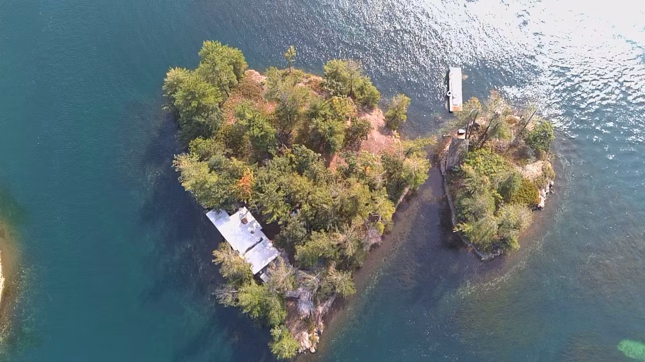 Aerial view of the main island, small island, houseboat and private dock